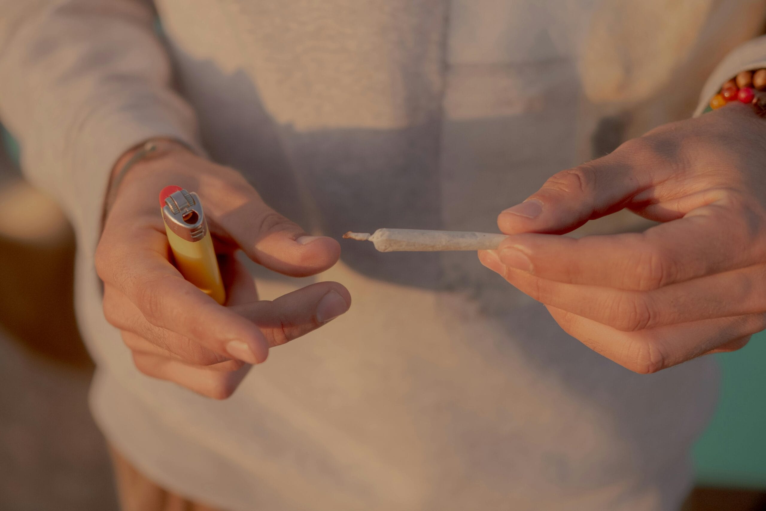 A man rolling a joint