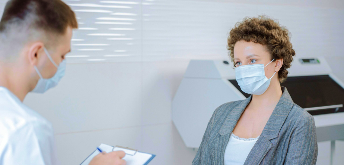 Doctor and Patient Talking in Office