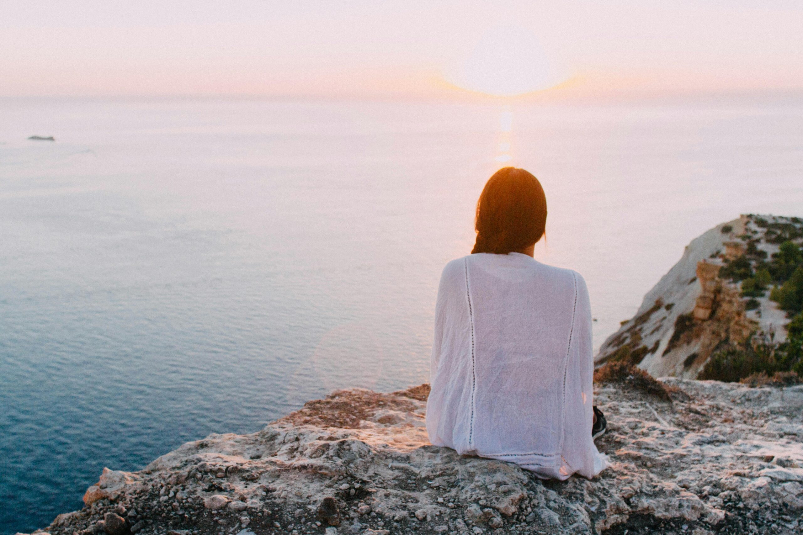 A woman looking at the sea