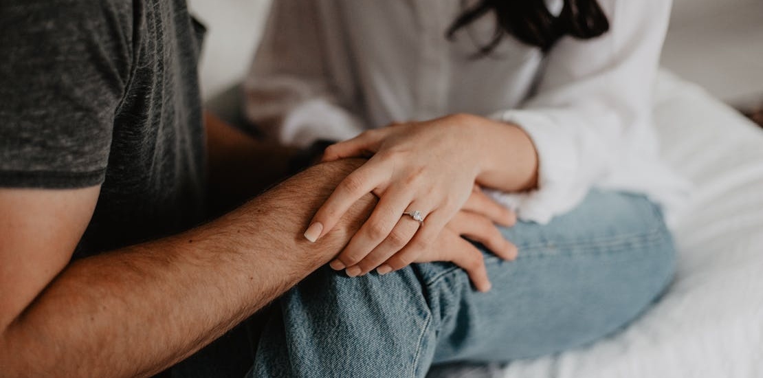 Peopel holding hands in support