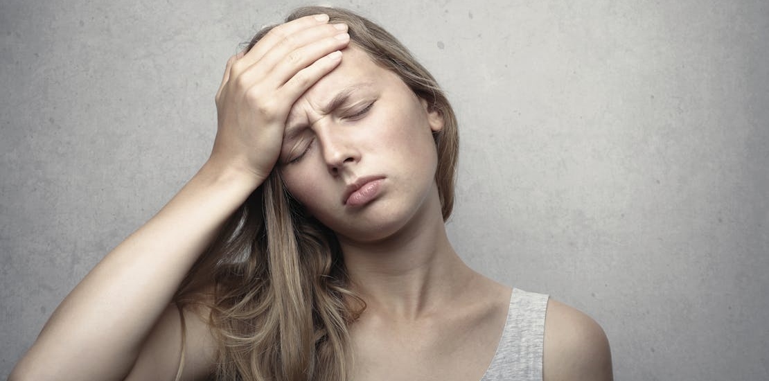 A woman experiencing problems with alcohol detox at home. 