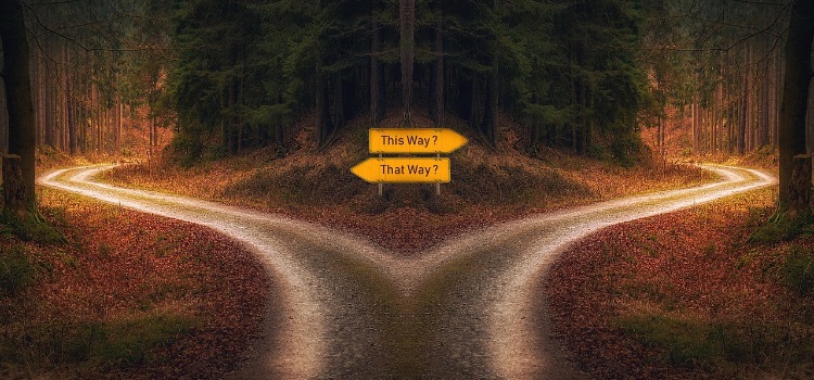 Signpost at a crossroads representing the decision to choose healthy coping mechanisms during addiction recovery.