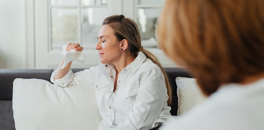 A woman crying in psychotherapy