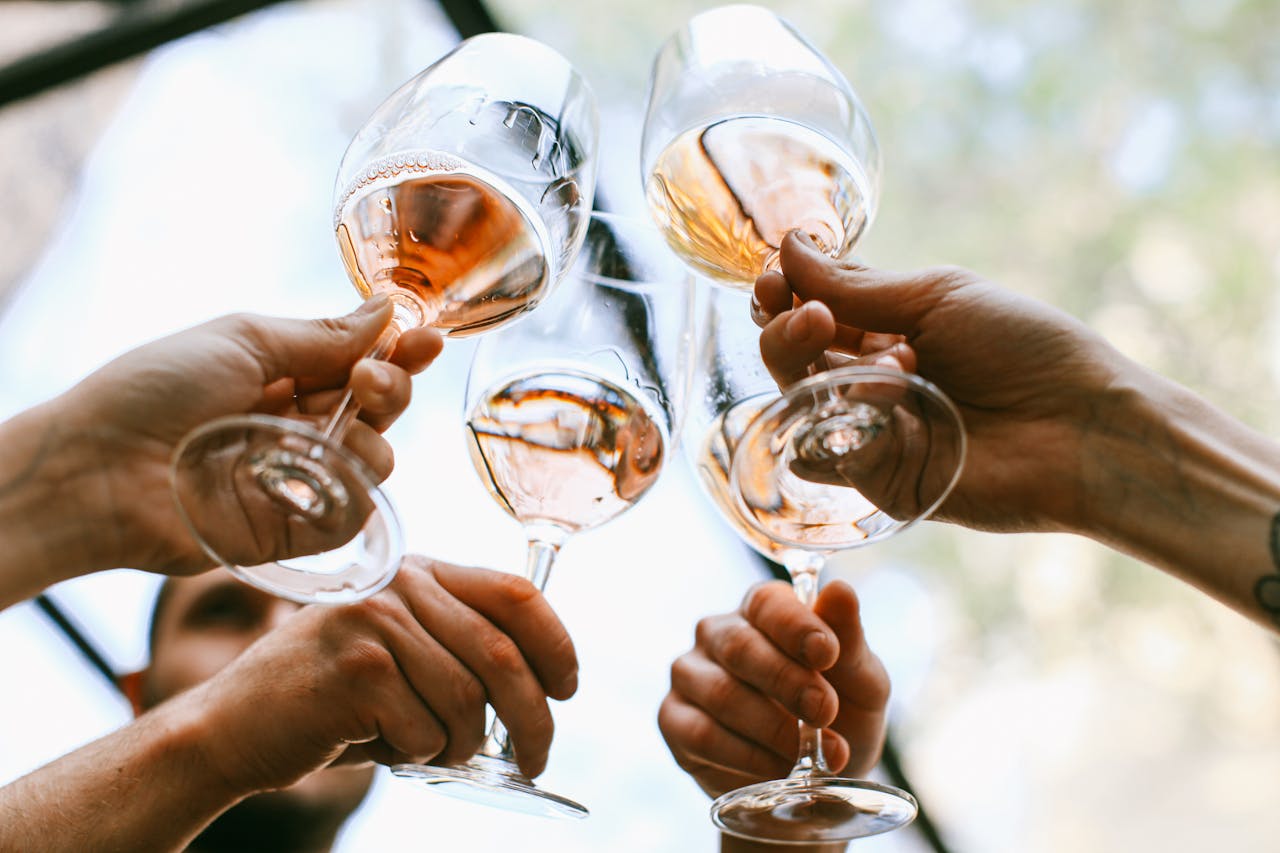 Glasses with drinks as a symbol of alcoholism in the workplace