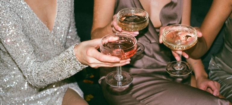 people holding drinks