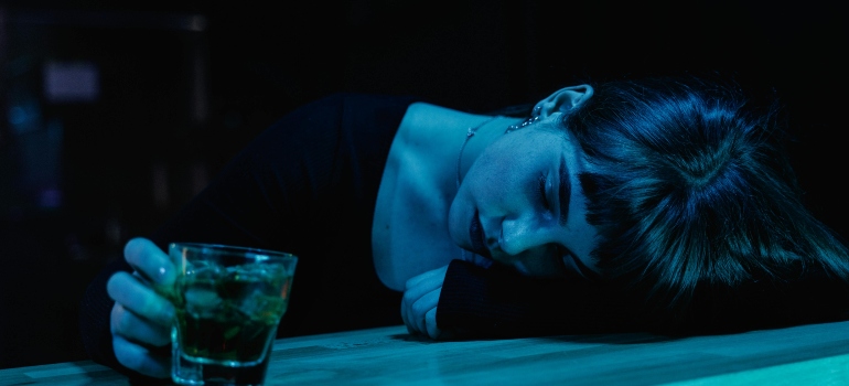 a girl intoxicated lying on the table