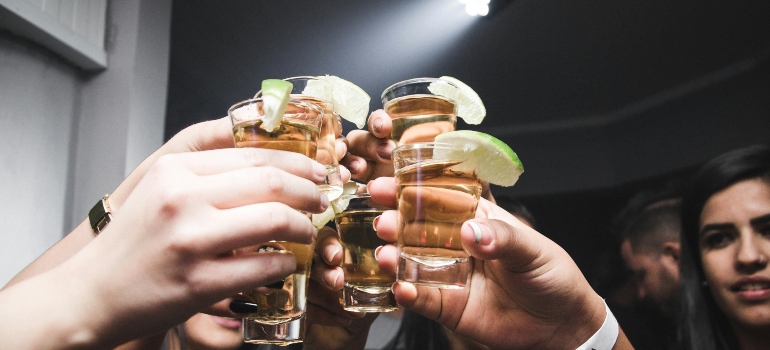 the girls are toasting with their glasses
