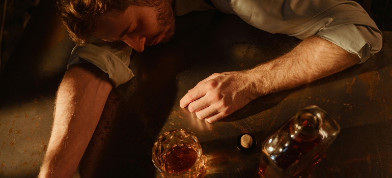 a man sleeping under the influence of alcohol