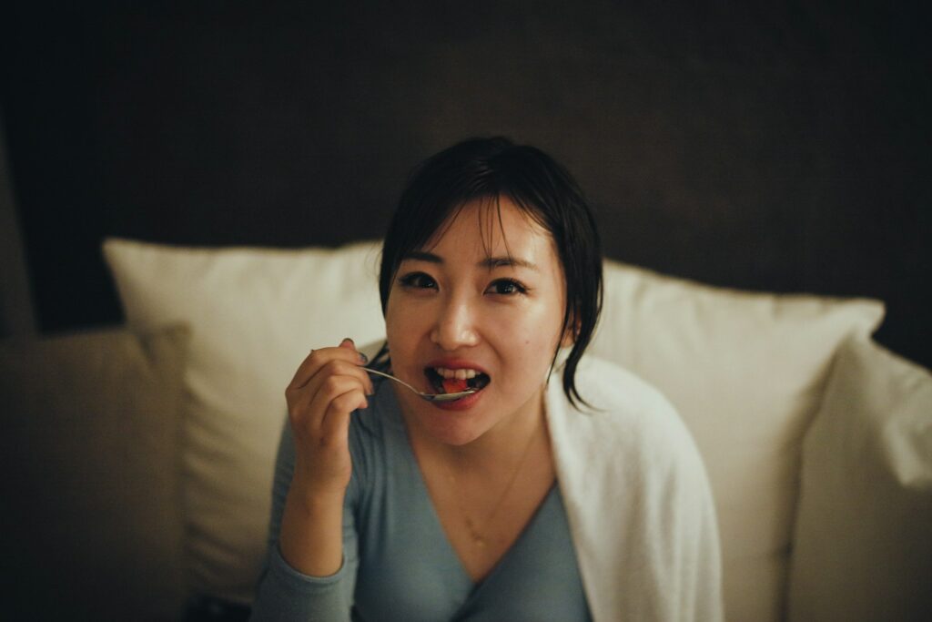 woman eating and talking about nutrition and addiction recovery