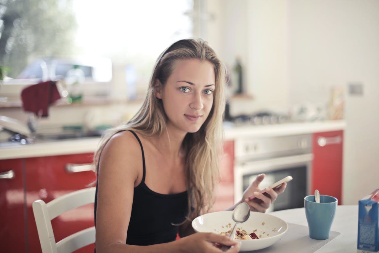 woman eating and thinking about nutrition and addiction recovery