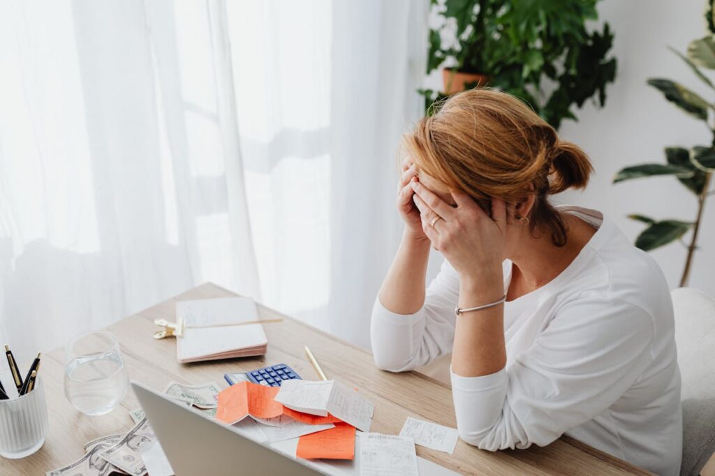 woman thinking about money management in addiction recovery
