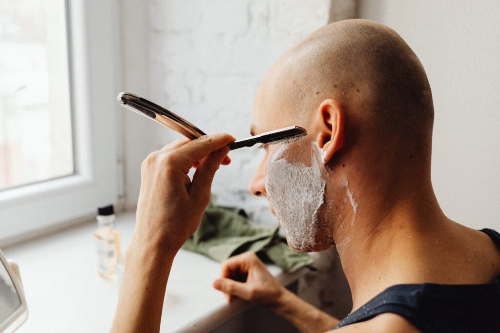 a man shaving and thinking about coping with social anxiety