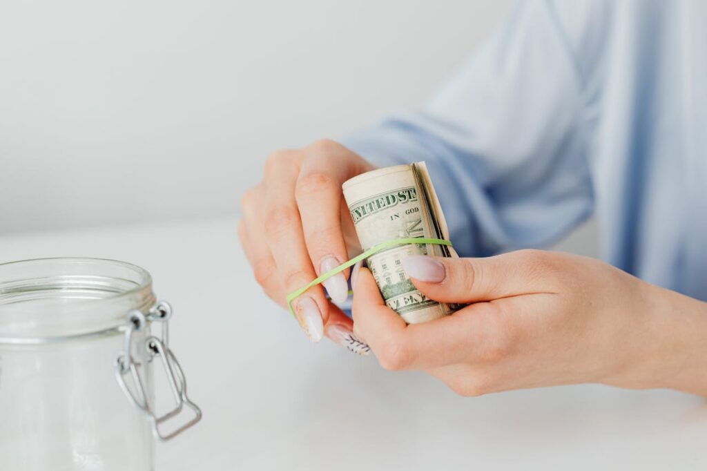 putting money in a jar