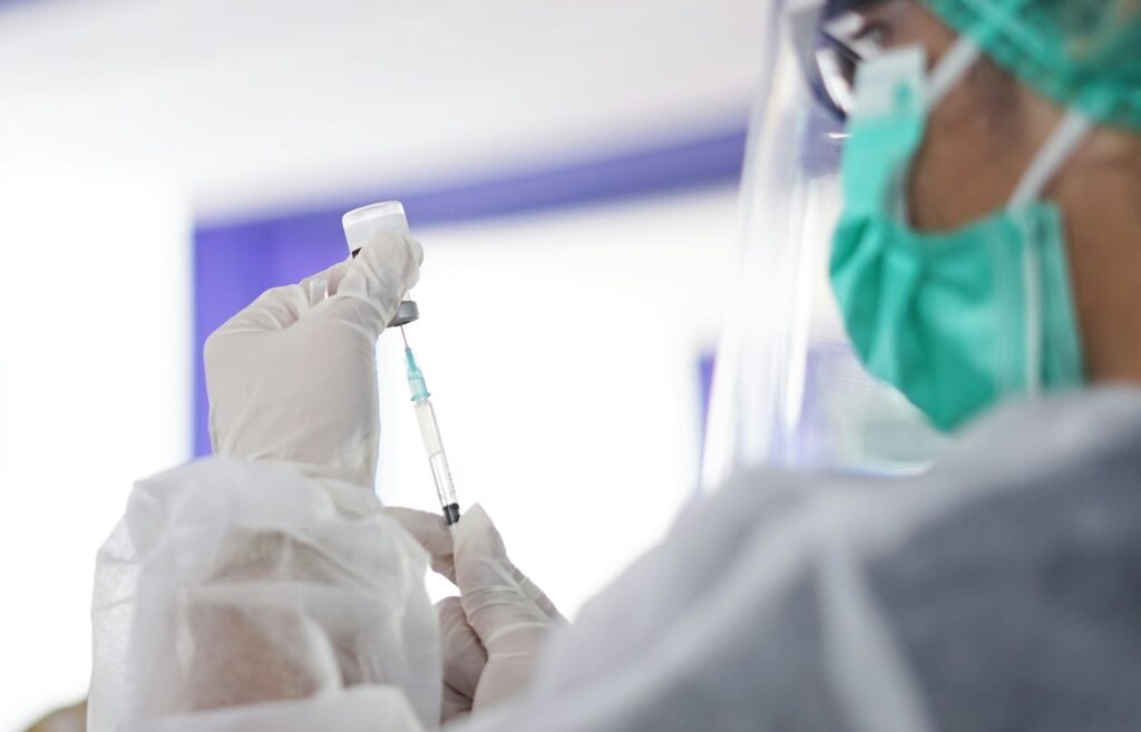 doctor checking a needle