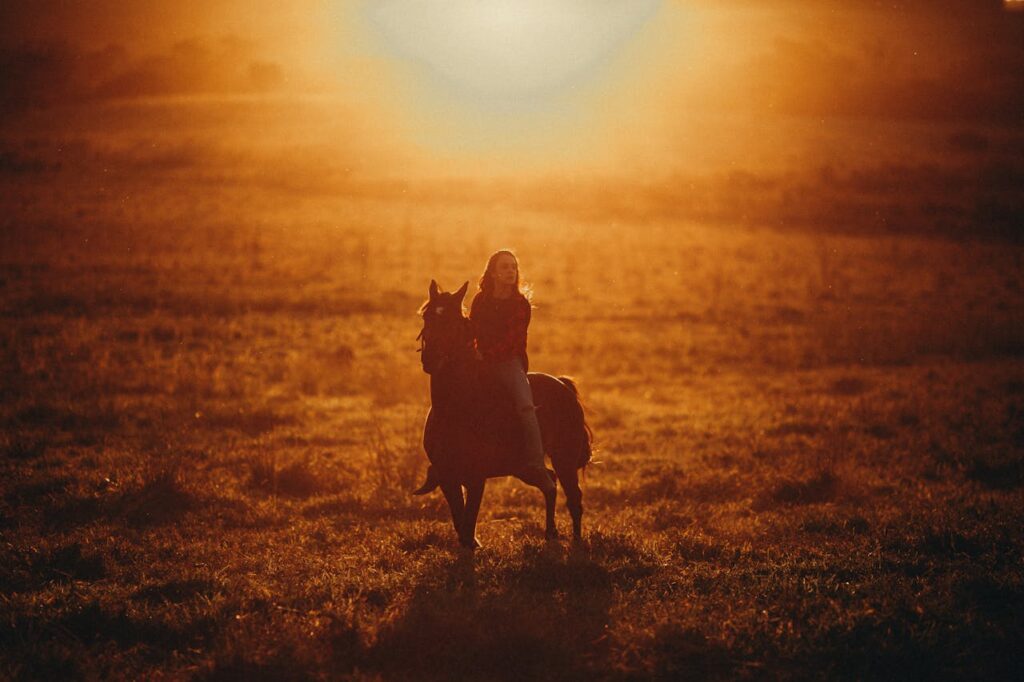 a woman riding a horse