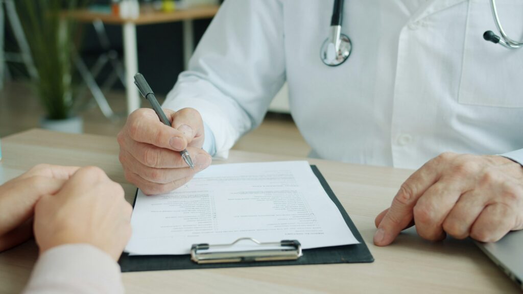 doctor writing a report