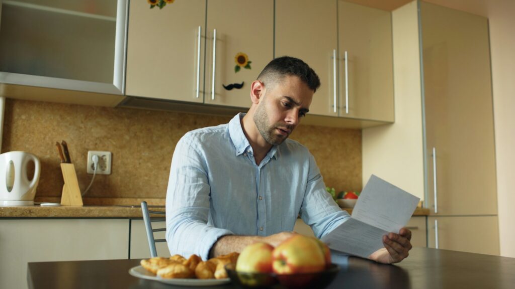 a man reading FAQs about addiction treatment