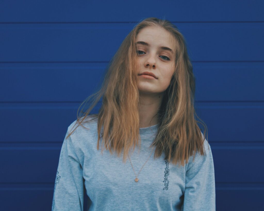a girl thinking about how to help adult child with addiction