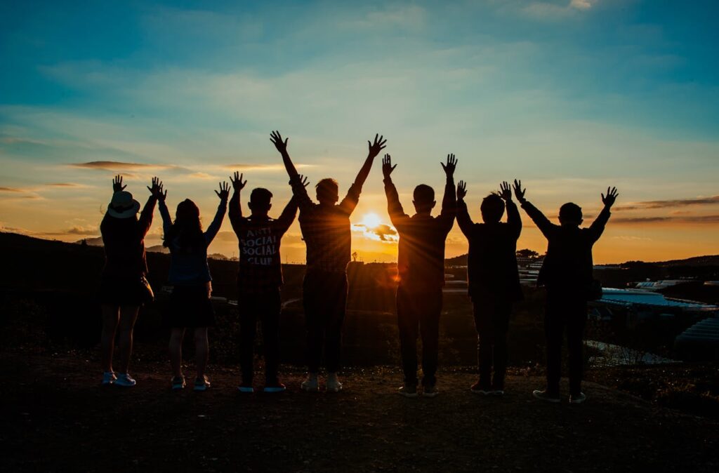 group of friends enjoying sunset