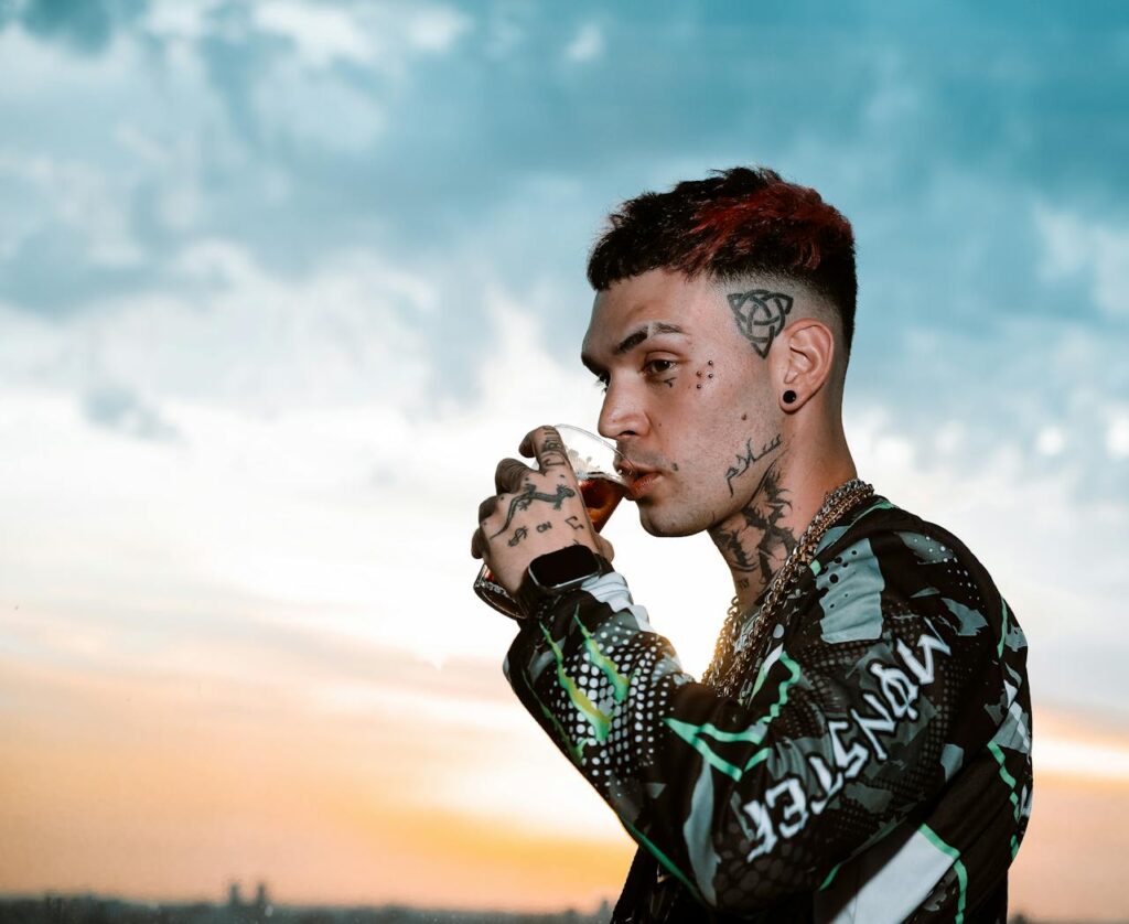 young man drinking and thinking about alcohol statistics